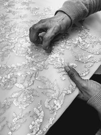 High angle view of woman working on fabric