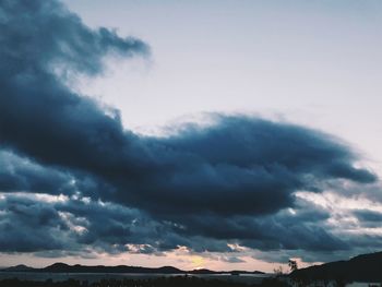 Low angle view of cloudy sky during sunset