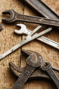 High angle view of work tools on wooden table