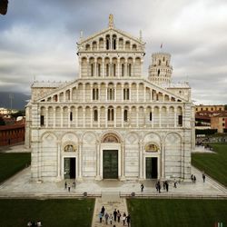 Low angle view of historic building against cloudy sky