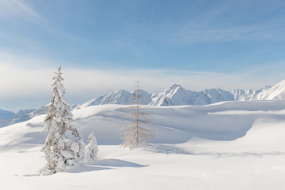 Scenic view of snowcapped mountains against sky