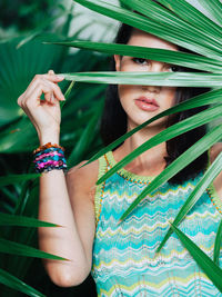 Portrait of young woman in tropical setting