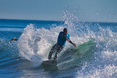 Man splashing water in sea