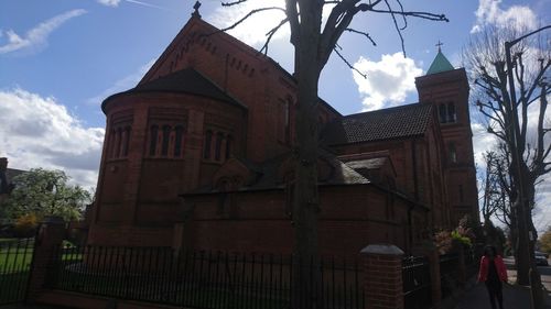 Low angle view of clock tower against sky