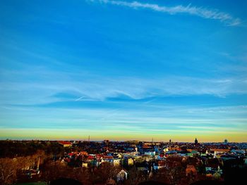 High angle shot of townscape against blue sky