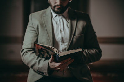 Young man holding book