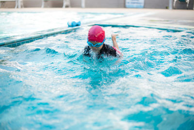 Girl swimming in pool