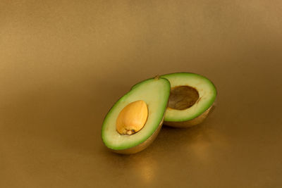 Close-up of green fruit on table