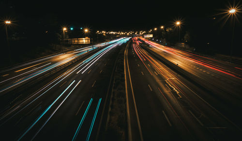 High angle view of light trails on road at night