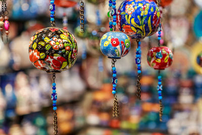 Close-up of decoration hanging for sale in market