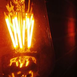 Close-up of illuminated light bulb