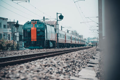 Train at railroad station against sky