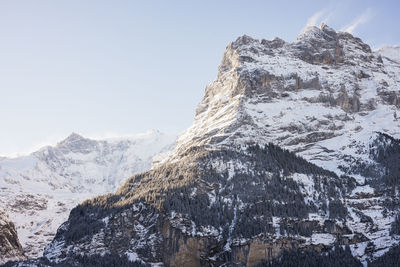 Scenic view of snowcapped mountains against clear sky