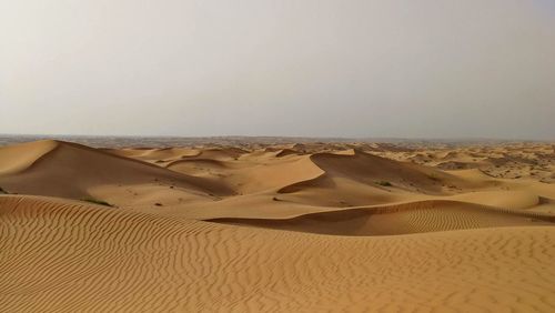 Scenic view of desert against clear sky