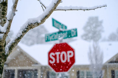 Close-up of road sign on snow