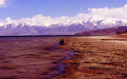 Scenic view of snowcapped mountains against sky