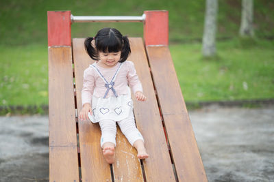 Portrait of cute girl standing in park