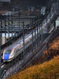 Train on railroad tracks in city