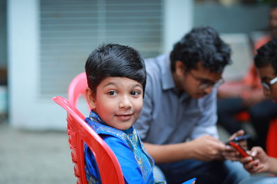 Side view of boy playing in workshop