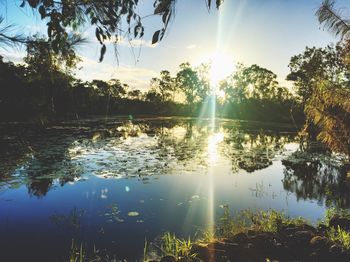 Scenic view of lake against sky during sunset