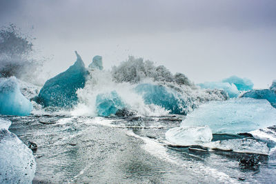 Scenic view of sea against sky during winter