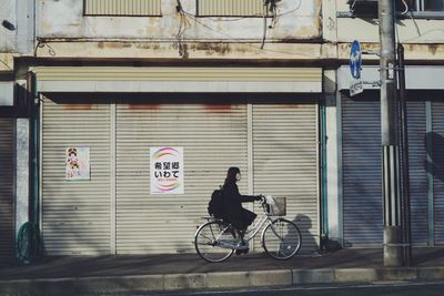 Man riding bicycle in city