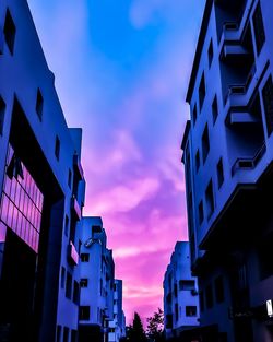 Low angle view of illuminated buildings against sky