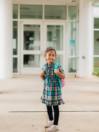 Diverse mixed race pre school age girl heading back to school after summer break