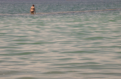 Man swimming in sea