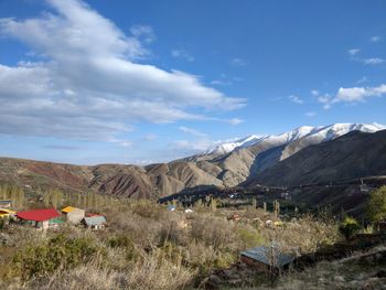 Scenic view of landscape and mountains against sky