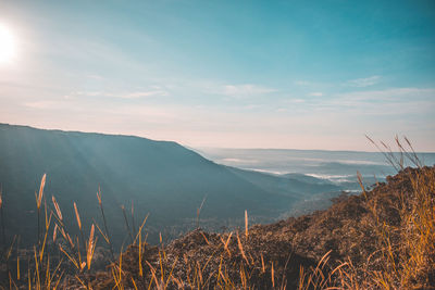 Scenic view of sea and mountains against sky