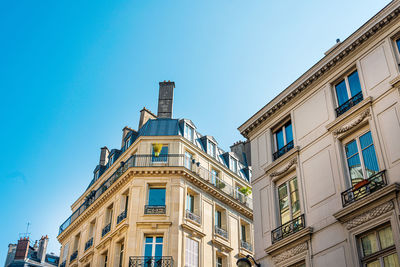 Low angle view of buildings against clear sky