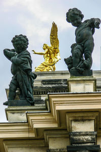 Low angle view of statue against sky