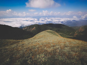 Scenic view of landscape and mountains against sky