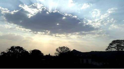 Scenic view of landscape against cloudy sky