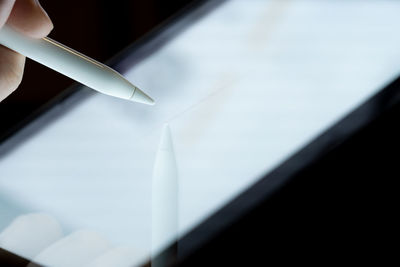 Close-up of glass window against ceiling