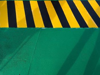 High angle view of yellow umbrella on road