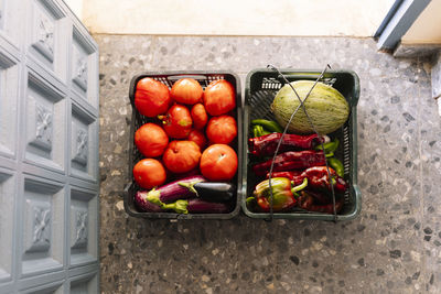 Fresh cultivated vegetable baskets at entrance