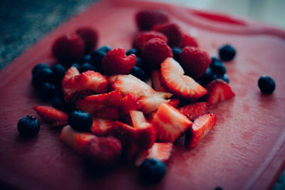 Close-up of chopped fruits on table