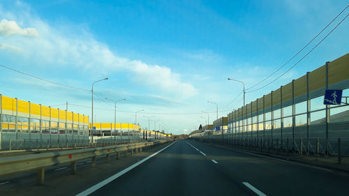 View of road against cloudy sky