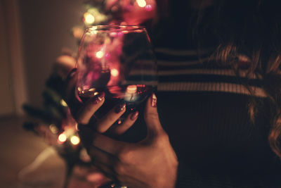 Close-up of woman drinking glass