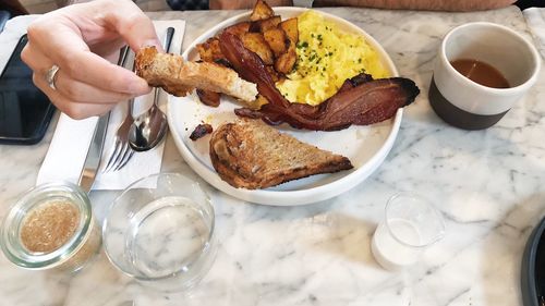 Cropped image of man having breakfast