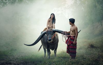 Friends standing in a field