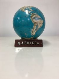 Close-up of information sign against white background