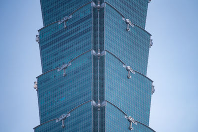 Low angle view of modern building against clear blue sky