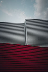 Low angle view of red building against sky