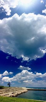 Scenic view of sea against cloudy sky