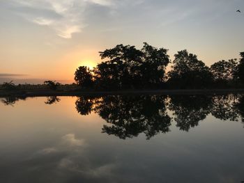 Scenic view of lake against sky during sunset