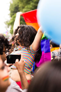 Rear view of woman using mobile phone