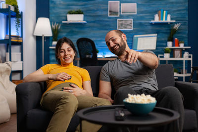 Young man sitting at home